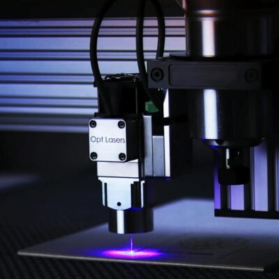 Close-up of cutting-edge laser engraving machine in a precision manufacturing process.