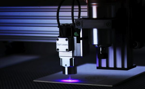 Close-up of cutting-edge laser engraving machine in a precision manufacturing process.