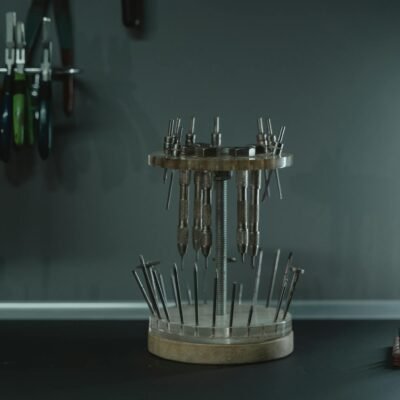 Tools arranged in a jewelry workshop, showcasing organized craftsmanship and precision.